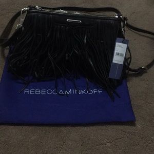 Crossbody black purse with fringe on both sides